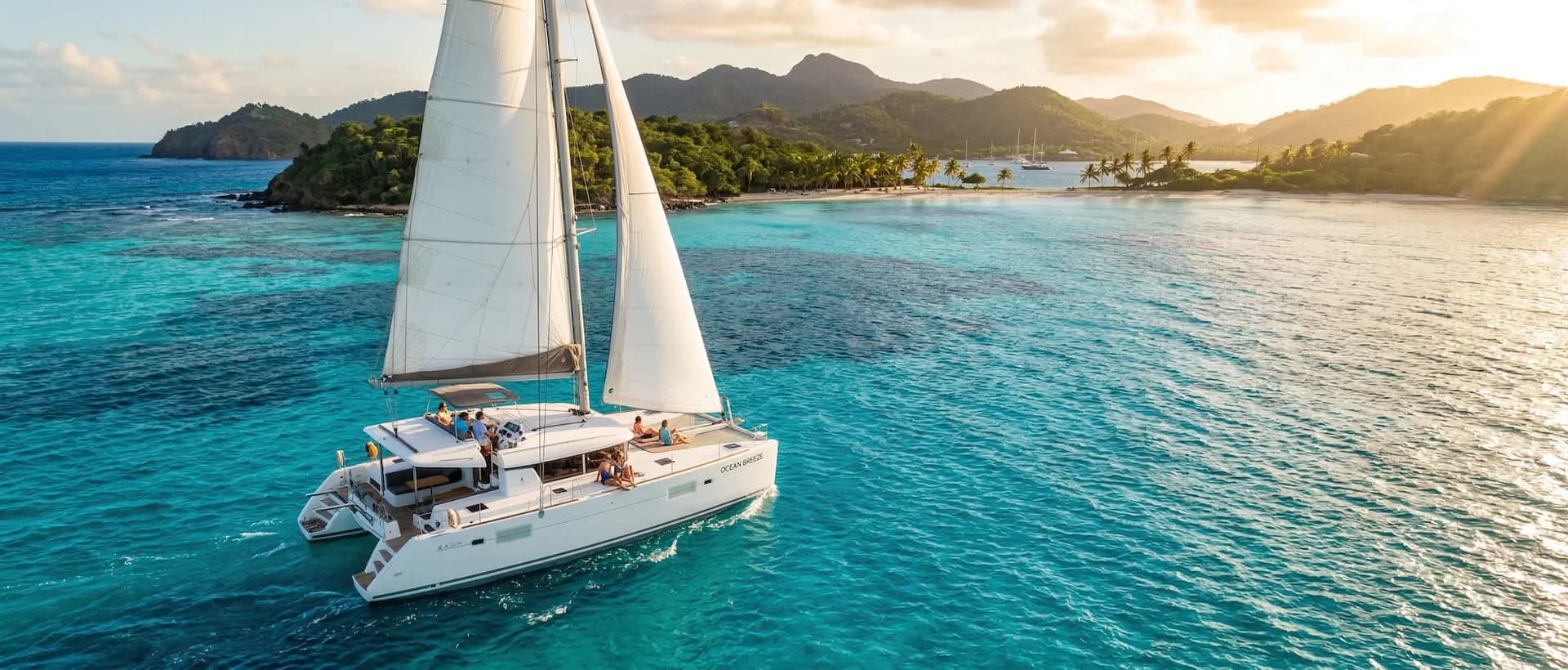 Catamaran sailing through turquoise Caribbean waters