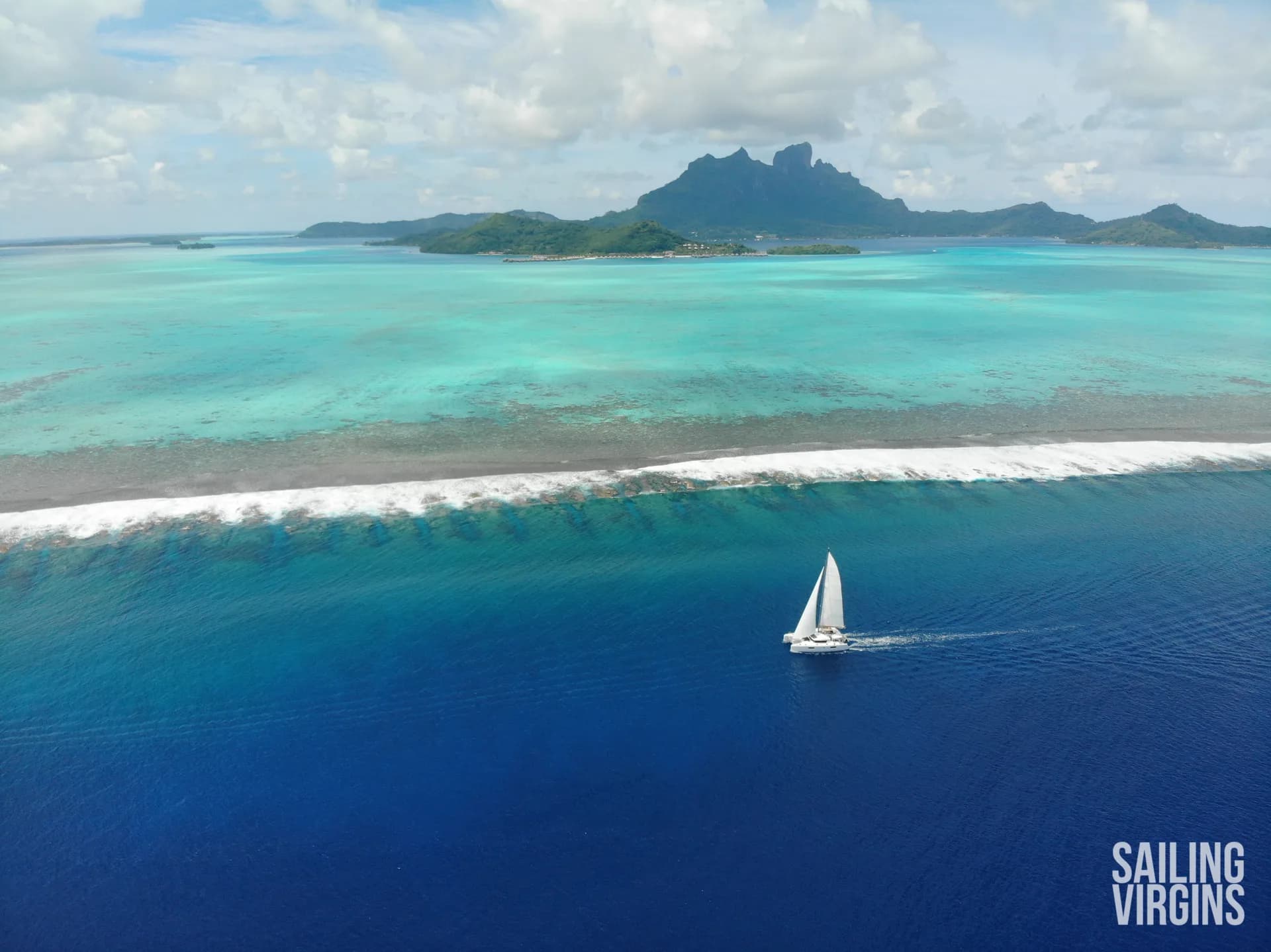 Aerial view of sailboat in Bora Bora lagoon
