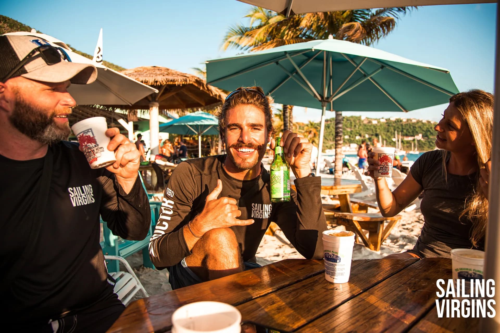 Crew enjoying drinks at a beach bar