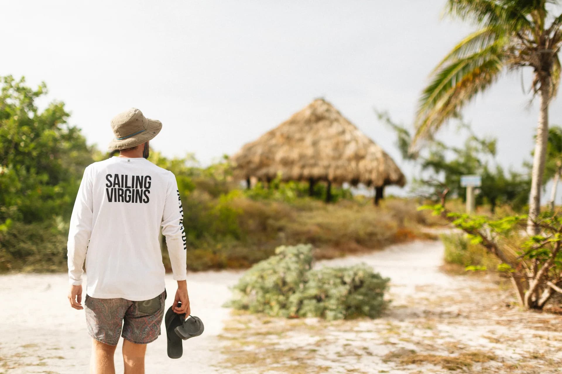 Walking on a tropical island in Sailing Virgins gear