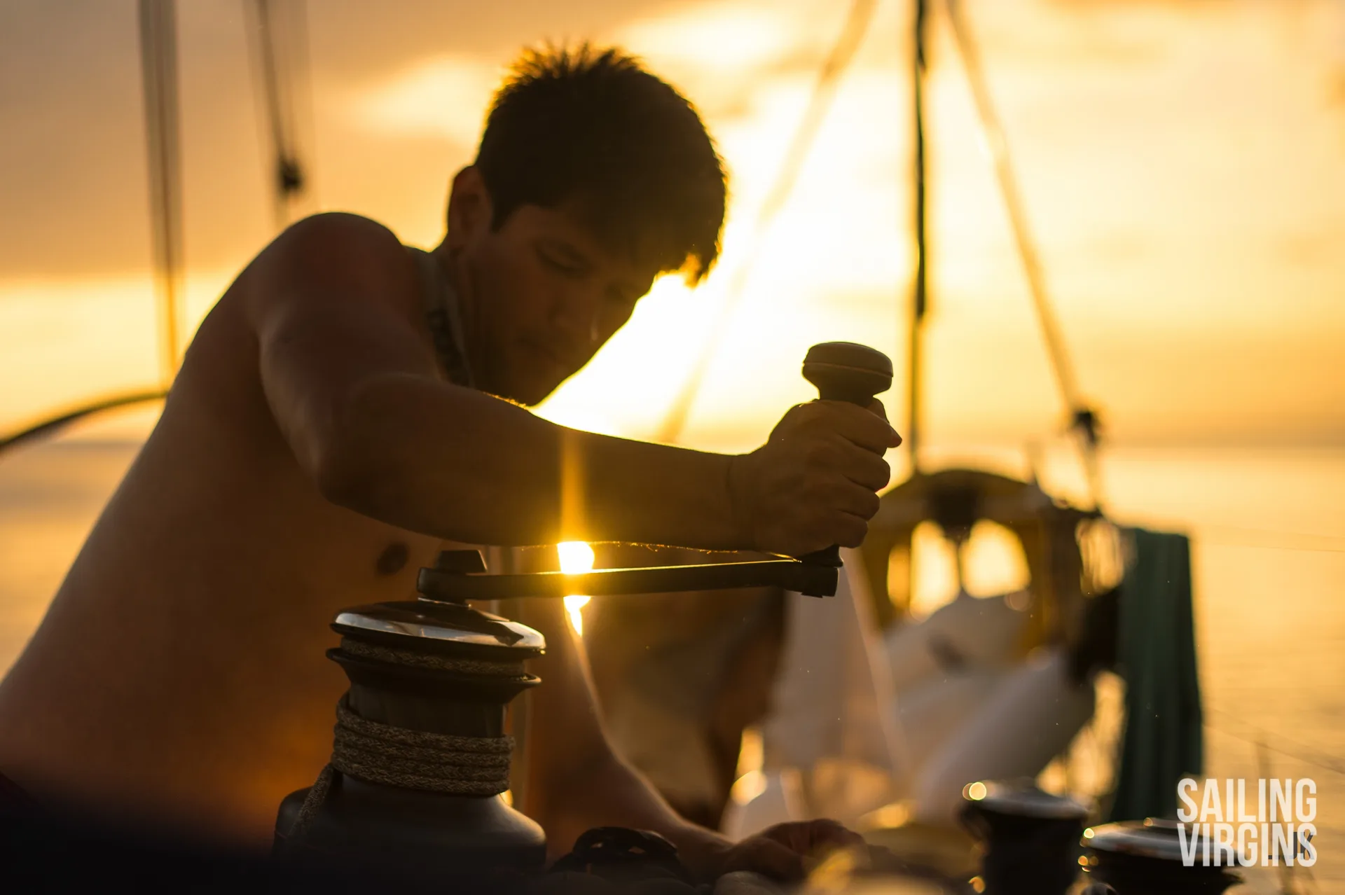 Student winching at sunset