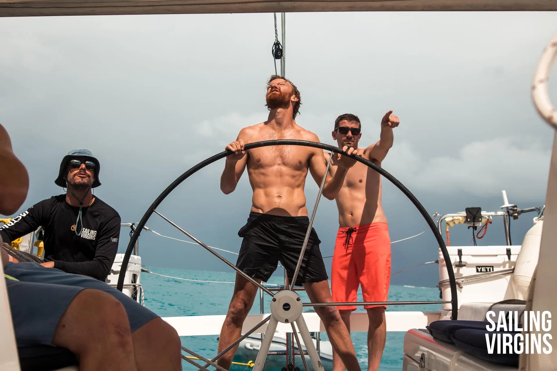 Crew having fun helming in the cockpit