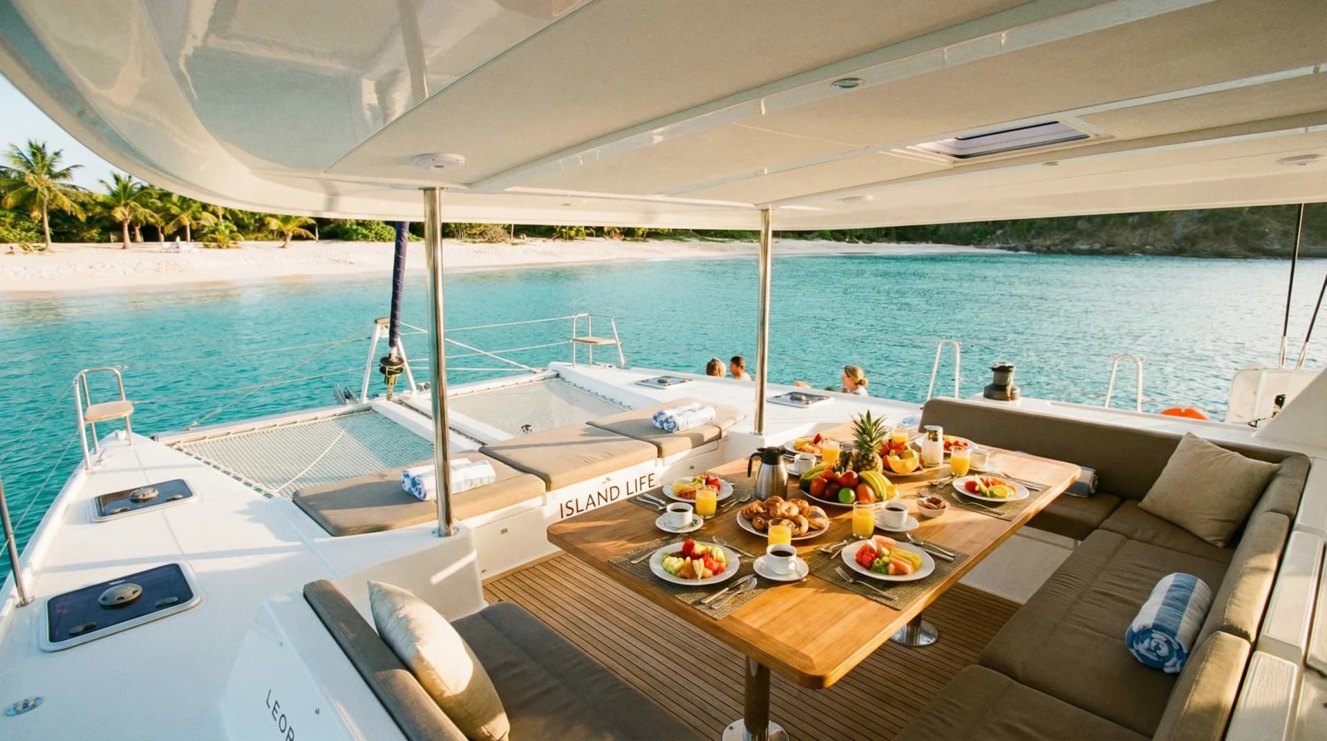 Morning sunrise on deck in St. Martin with golden light over calm waters