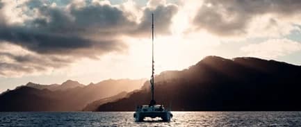 Crew anchoring in secluded bay
