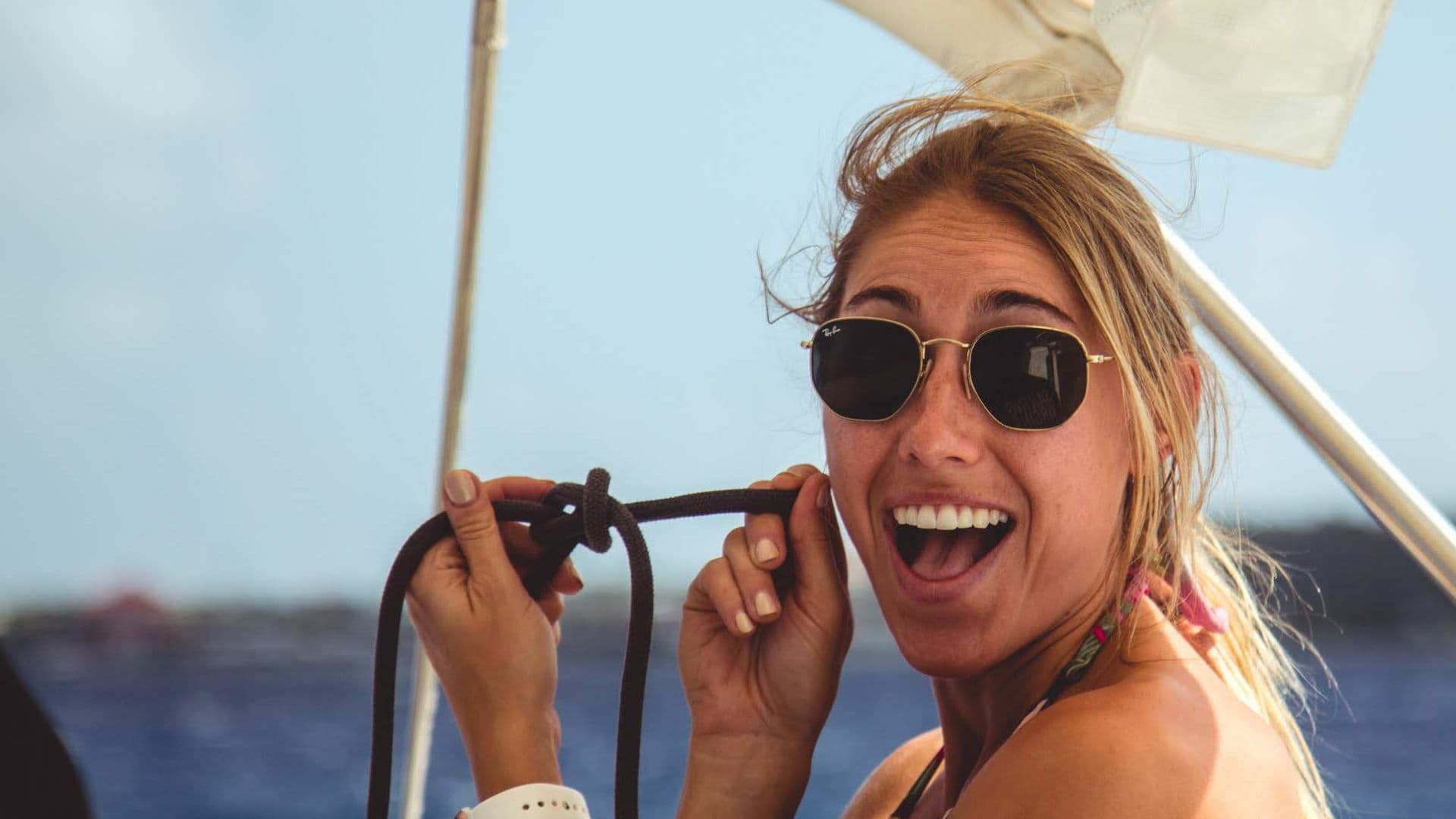 Catamaran anchored in a secluded bay with turquoise waters